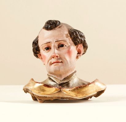 null Bust of a saint in polychrome, gilded and silvered terracotta, glass eyes.
Very...