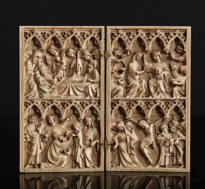 Large ivory diptych deeply carved on two...