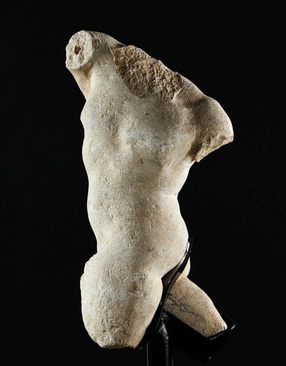 null Acephalous faun in carved Costoza stone. The right leg forward, the other thrown...