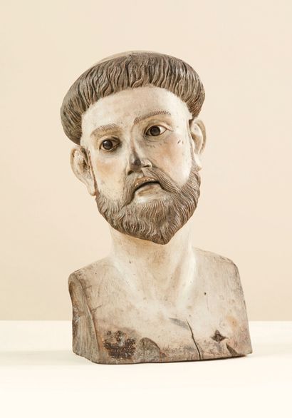 null Bust of Saint Francis in carved and polychromed wood, glass eyes. The head slightly...