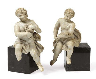  Pair of sculpted marble angels, allegories of Autumn and Summer. The head slightly...