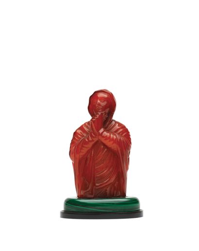null Bust of Virgin in prayer in amber sculpted in the round.
Dressed in a veil forming...