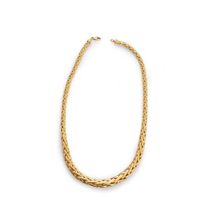 null 18K (750) yellow gold necklace with a thickened palm tree link in the center.

French...