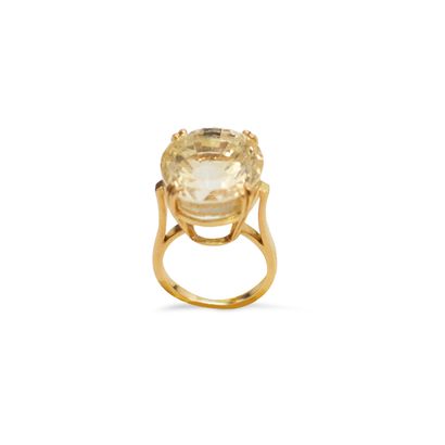 null An 18K (750) yellow gold cocktail ring set with a large oval citrine. French...