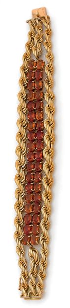 Chaumet. 
18K (750) yellow gold twisted cord bracelet with a double row of citrines.
French...