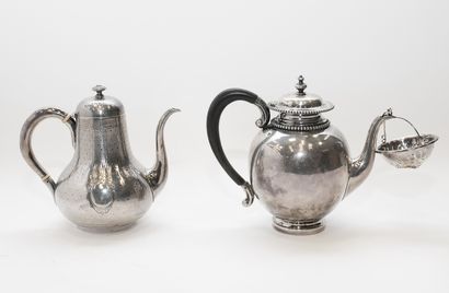 null Lot including a silver teapot and a silver plated teapot. A silver plated tea...
