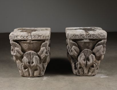 null 
PAIR OF CAPITALS in carved stone all faces. Basket with decoration on three...