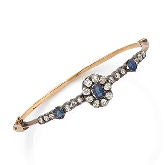 null Bracelet in 18K (750) gold and silver (800), adorned with 3 oval sapphires in...