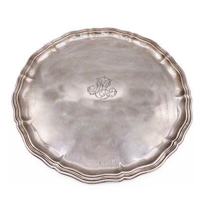  Two silver plated trays, one round with contours and the other with a frieze of...