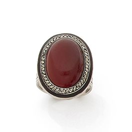 null Silver ring (800), decorated with a cabochon of carnelian surrounded by pyrite...
