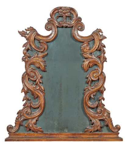 Shaped mirror with carved wood friezes, partly...