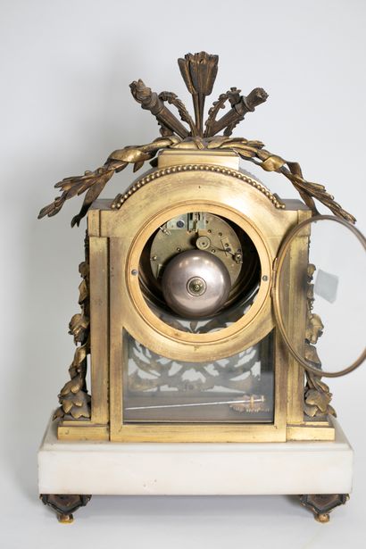 null Gilt bronze, glass and white marble clock, the circular white enamelled dial...