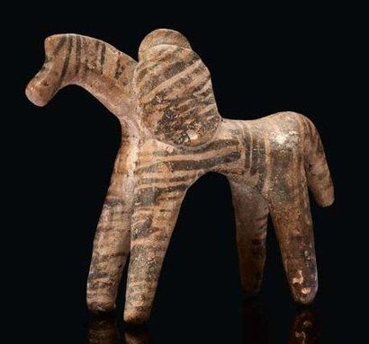 null Statuette représentant un cheval, la robe figurée par des bandes brunes, chevauché...