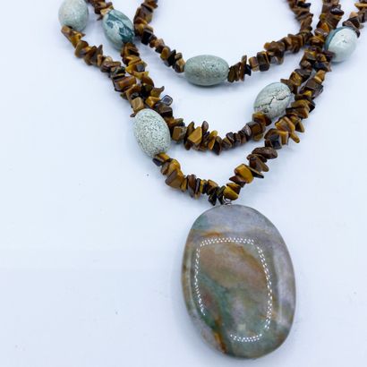 null Necklace composed of 3 rows of polished tiger eye beads of fancy size punctuated...