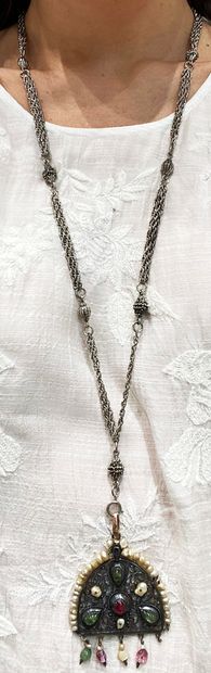 null Silver plated metal necklace composed of chains, holding a pendant openwork...