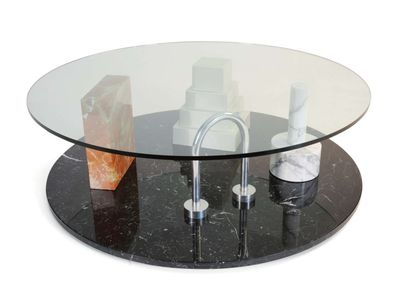 null table basse "park" à plateau circulaire en verre transparent reposant sur quatre...