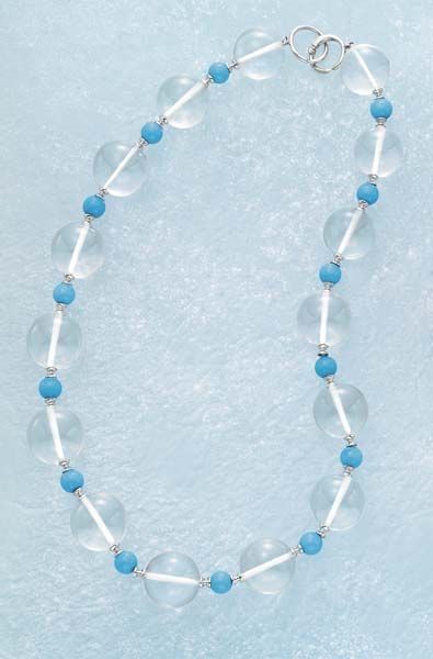 null A Rock Crystal and Turquoise Necklace Composed of spherical Rock crystal beads,...