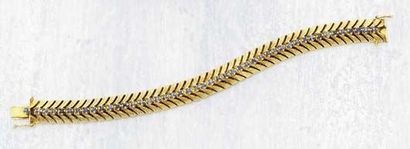 null A Diamond Sapphire and Gold Bracelet CARTIER circa 1940 Designed as a flexible...