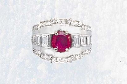 null A Diamond and Ruby Lady's Signet Ring MELLERIO circa 1930 The wide band Set...