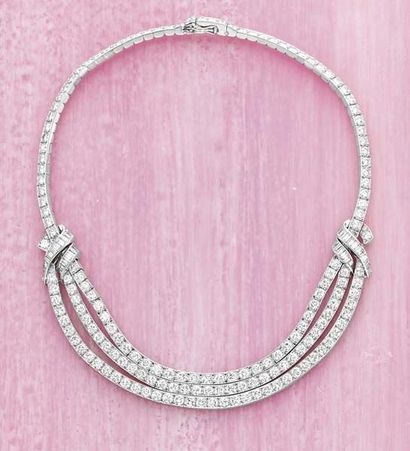 null A Diamond Necklace CARTIER circa 1950 The front suspending three swagged circular-cut...