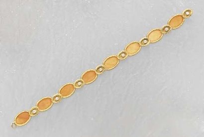 null ACoral Diamond and Gold Bracelet Designed as a series of oval Coral plaques...