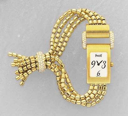 null A Lady's Gold Wrist watch PIAGET The rectangular White dial withArabic 3, 6...