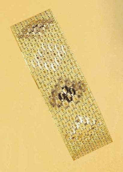 null A Gold Bracelet Designed as a flexible woven Gold band ,mounted in rose and...