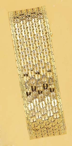 null A Gold Bracelet Designed as a flexible woven Gold band ,mounted in rose and...