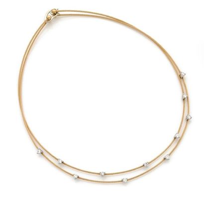 null COLLIER cable en or jaune 18K piqué de diamants sur chatons de platine. L_41...