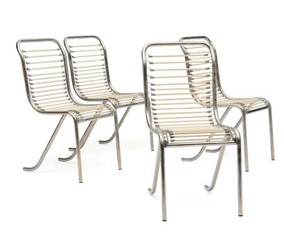 MICHEL DUFFET (1888-1985) Suite de quatre chaises en métal chromé et sangles élastique....