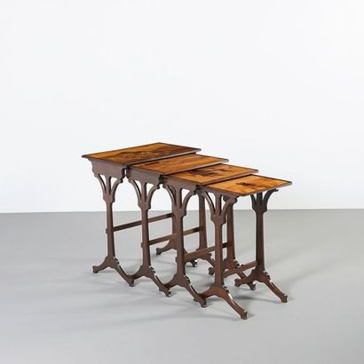 ÉMILE GALLÉ (1846-1904) 
Suite de quatre tables gigognes à décors paysagers
Bois...