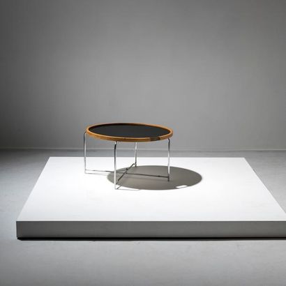 HANS J. WEGNER (1914-2007) 
Table basse circulaire à plateau réversible
Métal chromé,...