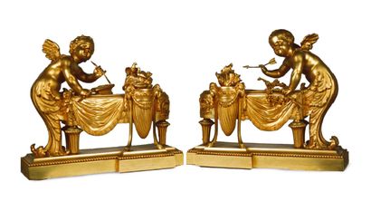 PAIRE DE CHENETS en bronze ciselé et doré décoré du thème de «L'Amour forgeron»....