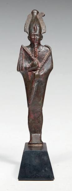 null STATUETTE D'OSIRIS.
Statuette votive représentant le dieu
Osiris momiforme,...