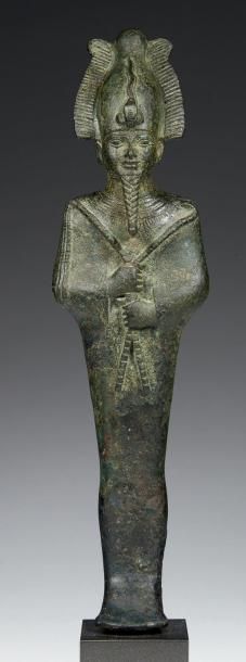 null STATUETTE D'OSIRIS.
Statuette votive représentant le dieu Osiris momiforme,...