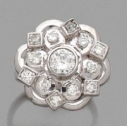 null BAGUE en or gris 18K (750) dessinant une fleur stylisée, centrée d'un diamant,...