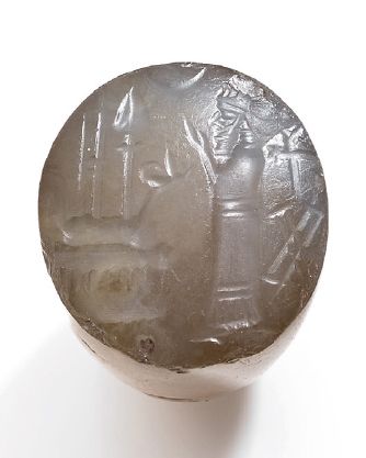 null CACHET: SCÈNE DE CULTE.
Art Néo-babylonien, ca. 600-350 av. J.-C.
Cachet conique...