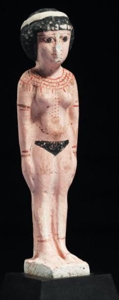 ÉGYPTE Statuette représentant une concubine. Elle est nue, debout sur une base, les...