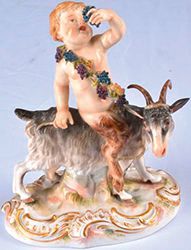 MEISSEN Bacchus enfant assis sur une chèvre, un pampre dans sa main gauche, marque...