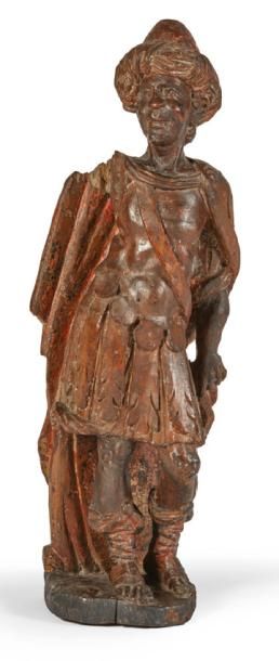 null ROI MAGE BALTHASAR en bois sculpté et polychromé, dos ébauché. La tête coiffée...