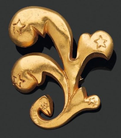 LINE VAUTRIN Broche Fleur à motif étoilé, en bronze doré. Signée. H_6 cm L_7 cm LINE...