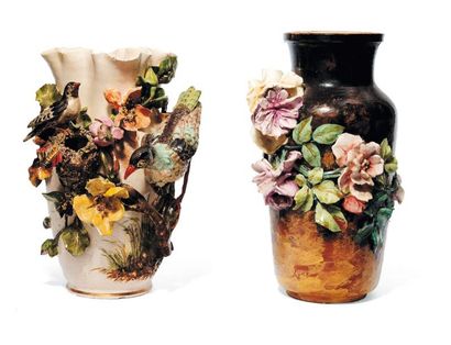 Deux vases en barbotine à décor, en relief,...