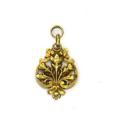 null Pendentif en or 18K (750), orné de fleurs de lotus stylisées. Travail français...