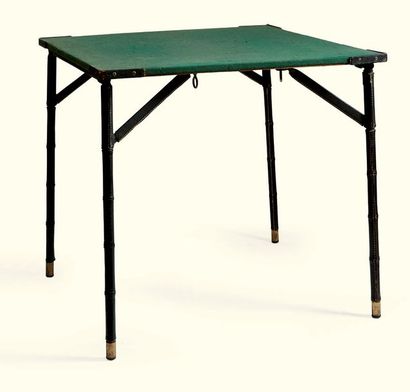 JACQUES ADNET 1900-1984 * Table à jeux, vers 1950

bois, métal et cuir, la plateau...