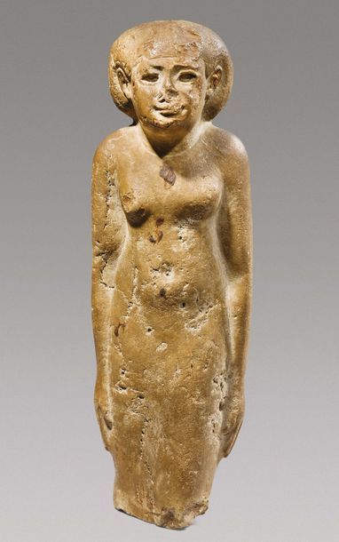 null ? STATUETTE DE FEMME.
Égypte, Époque Ptolémaïque, ca. Ier siècle av. J.-C.
Statuette...