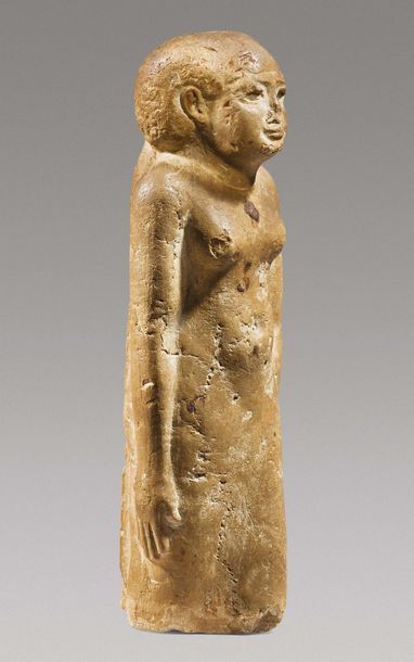 null ? STATUETTE DE FEMME.
Égypte, Époque Ptolémaïque, ca. Ier siècle av. J.-C.
Statuette...