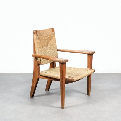 MARCEL GASCOIN 1907-1986 Rare et important fauteuil
Chêne vernis et paille
Édition...