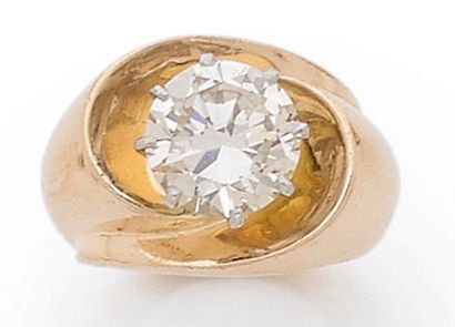 null BAGUE SPIRALE en or jaune 18K (750) ornée d'un diamant brillant de taille moderne...
