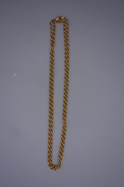 null Long collier en or jaune 14K (585/oo) à maille ronde imbriquée, le fermoir tonneau...