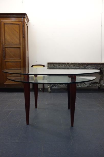 null TABLE moderne circulaire à deux plateaux de verre soutenus par quatre pieds...